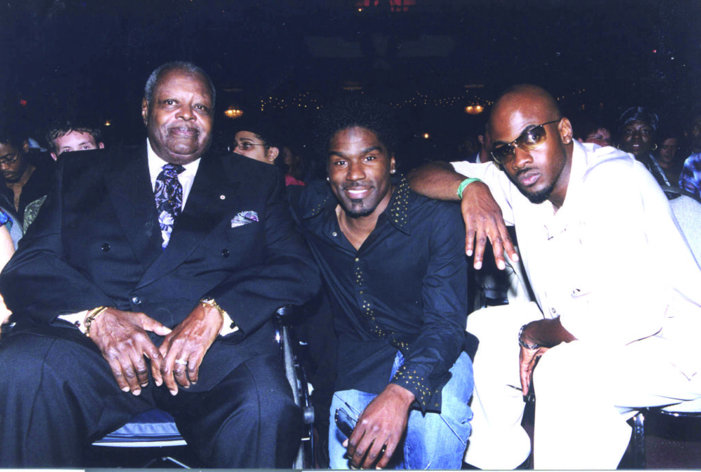 Oscar Peterson, Maestro, and Glenn Lewis posing for the camera, seated