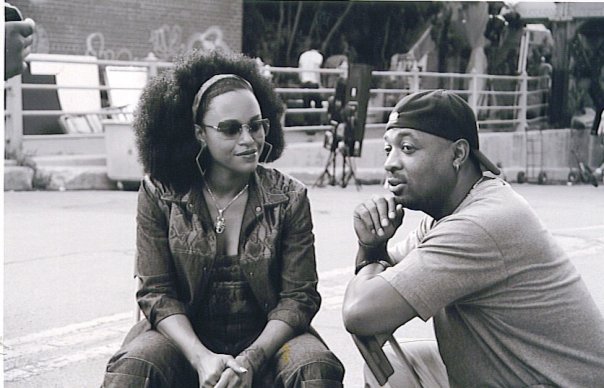 Michie Mee looking over to Chuck D