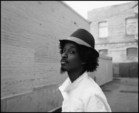 K'naan with a side glance towards the camera for a captivating photo shoot.