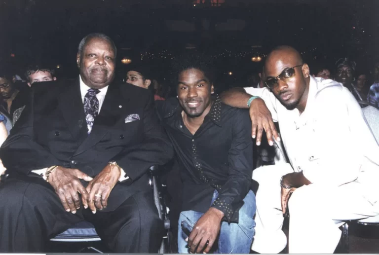 Award winners at the 2002 Urban Music Association of Canada Awards. Both Oscar Peterson and Maestro were presented with Lifetime Achievement Awards. Oscar sits on the far left of the image, Glen Lewis in the middle, and Maestro on the far right