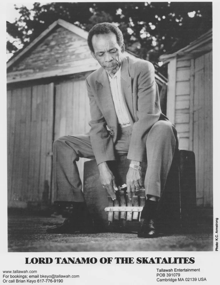 Lord Tanamo seated on the steps, booking agent card