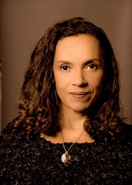 Andrea Thompson looking into camera, smiling and wearing black